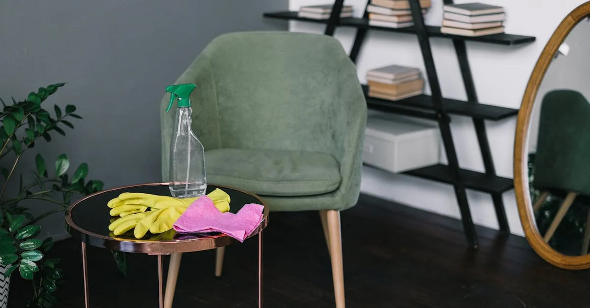 Yellow latex gloves placed near spray detergent bottle and rag on round table against comfortable chair in living room i