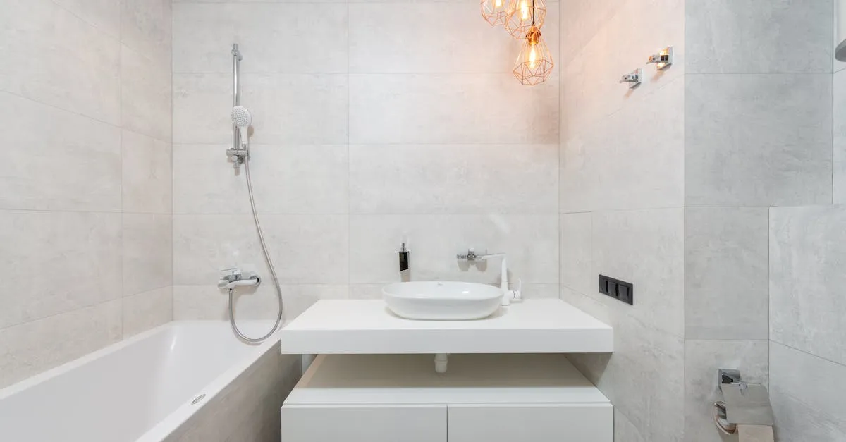 Bright, clean modern bathroom with marble tile and glass shower